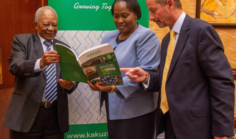 kakuzi chairman nicholas ng'ang'a joins the firms director pamella ager and managing director chris flowers in skimming through the firm's 2025 annual report and financial statements