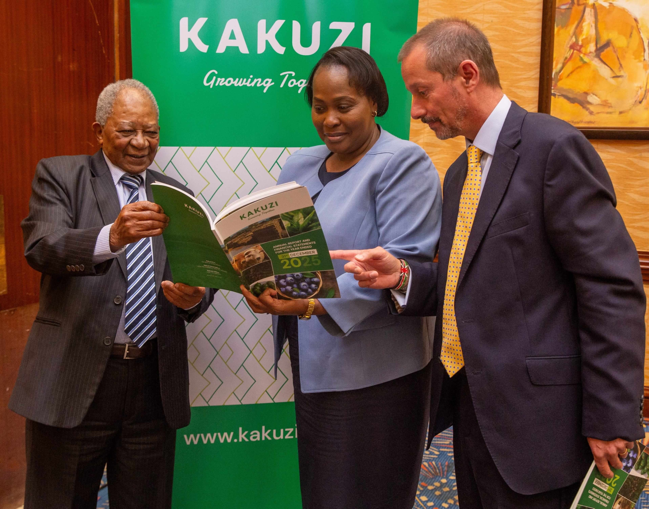 kakuzi chairman nicholas ng'ang'a joins the firms director pamella ager and managing director chris flowers in skimming through the firm's 2025 annual report and financial statements